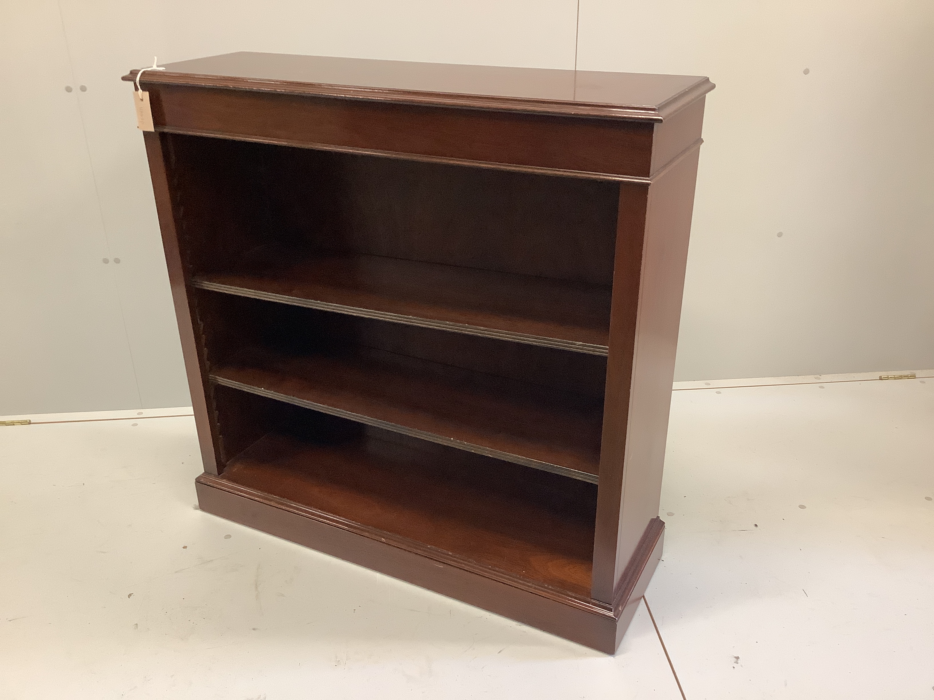A reproduction Victorian style mahogany open bookcase, width 102cm, depth 32cm, height 100cm
